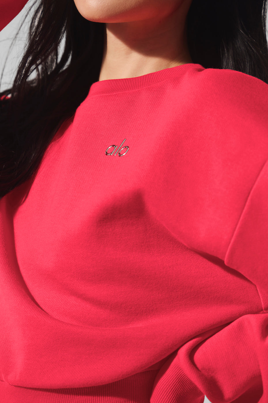 Front view of the Cropped Accolade Crewneck Sweatshirt in candy red.