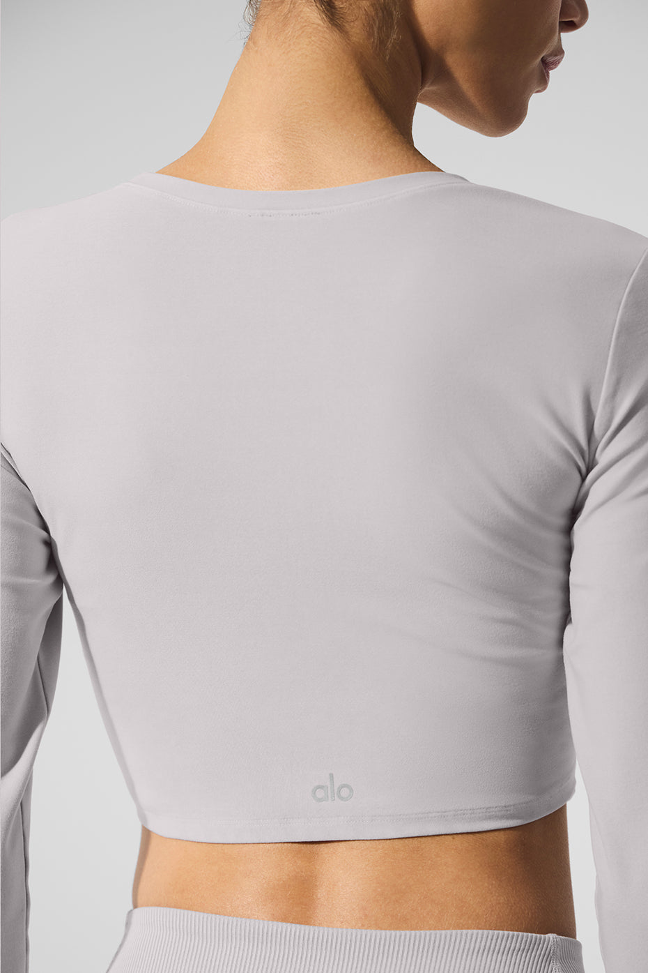 Front view of the grey sky wash crop shirt long sleeve on a mannequin for casual styling