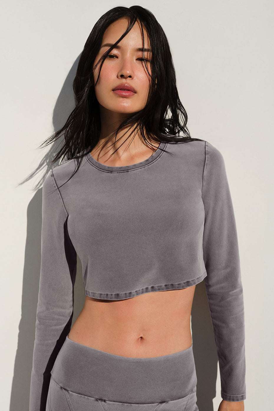 Front view of the chic washed alosoft cropped long sleeve top in cool grey.
