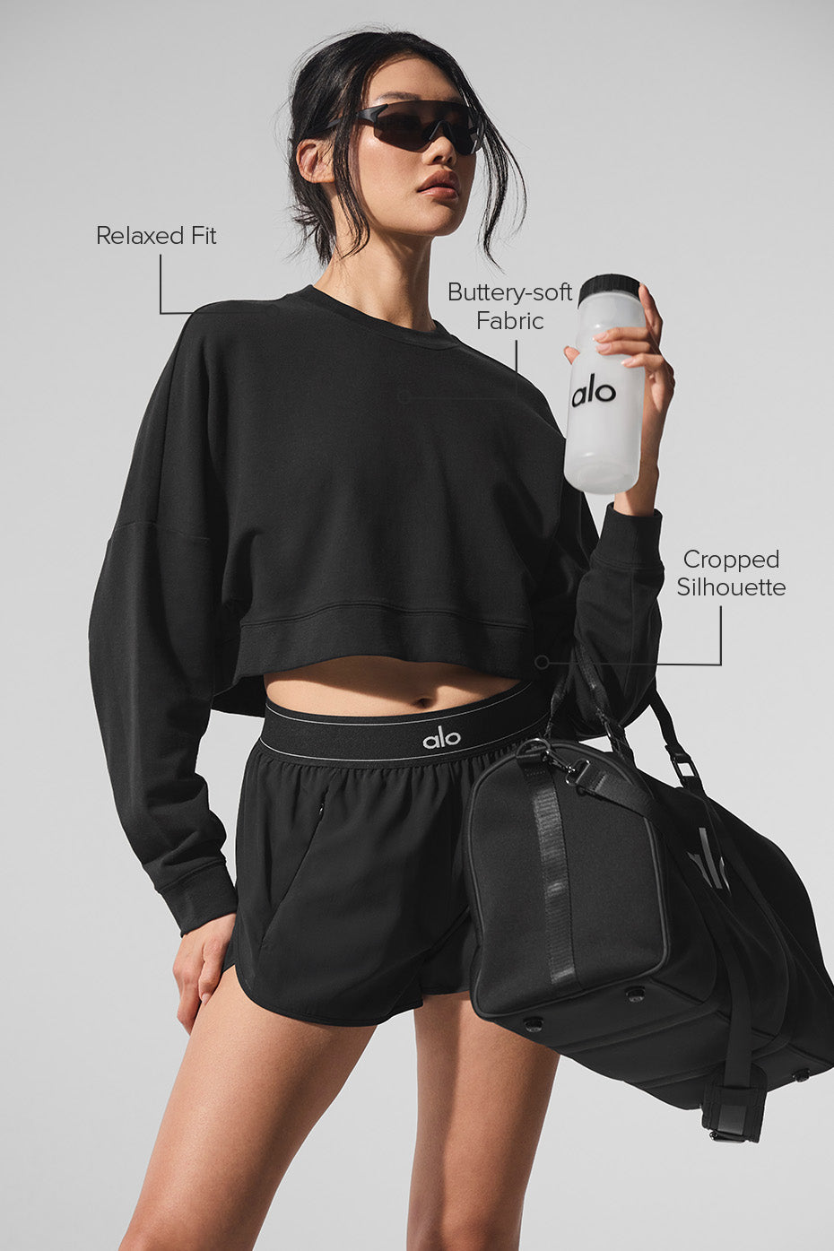 Side view showcasing the fit of the black pullover.