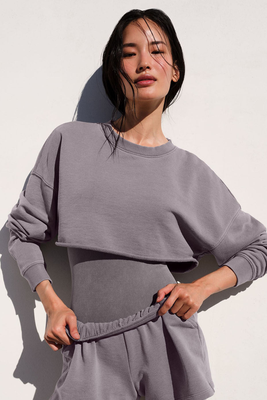 Front view of the chic washed extreme cropped pullover in cool grey.