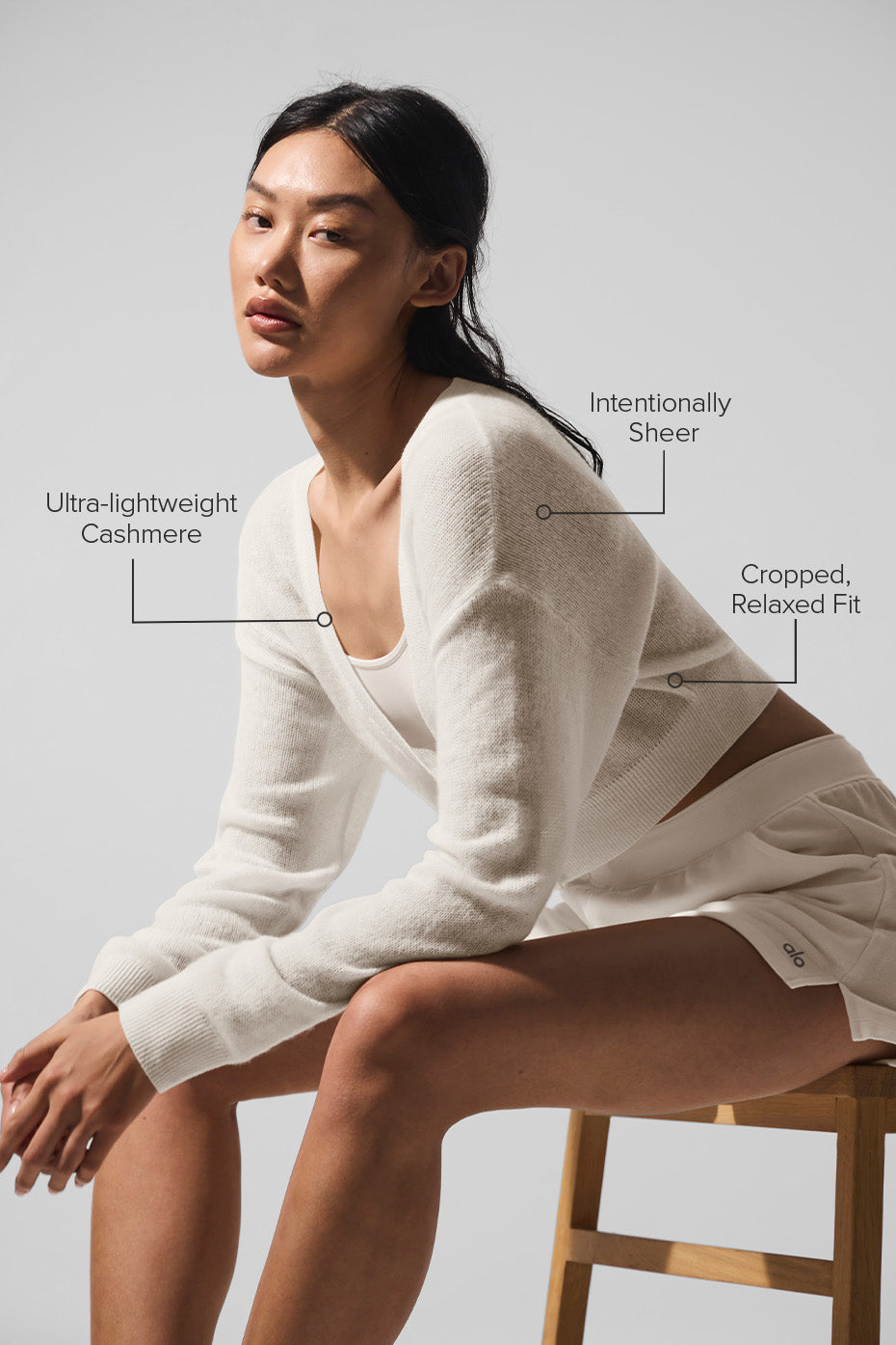 Close-up detail of the cardigans textured cashmere fabric
