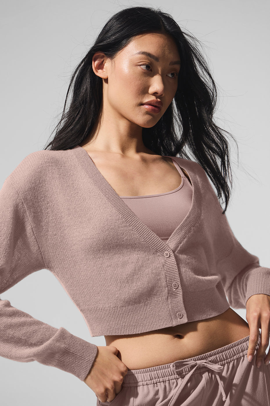 Side view of the sheer cashmere cardigan, showcasing its lightweight design.