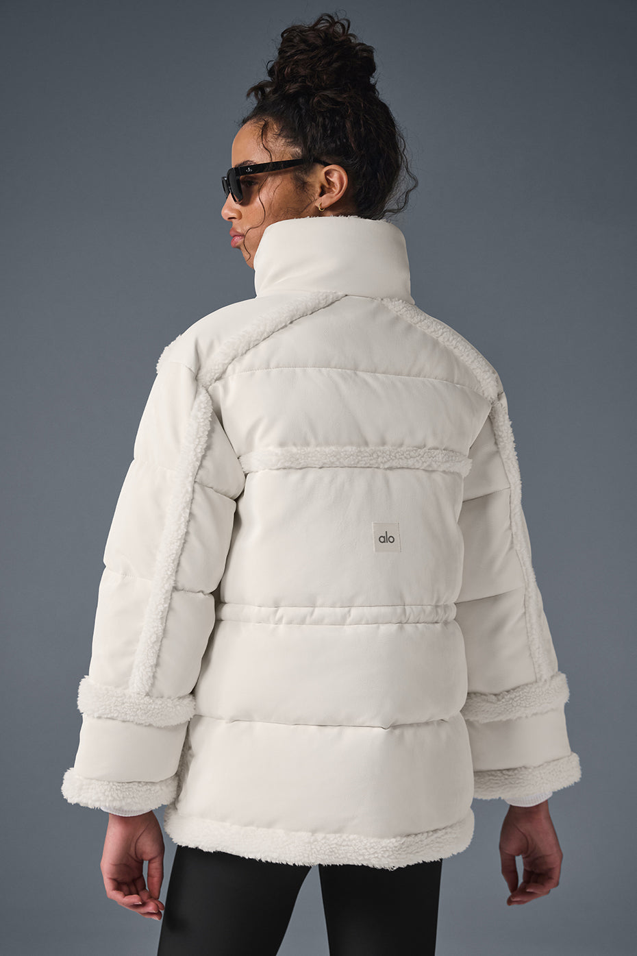 Model wearing the Ivory Luxe Puffer Jacket on a winter stroll.