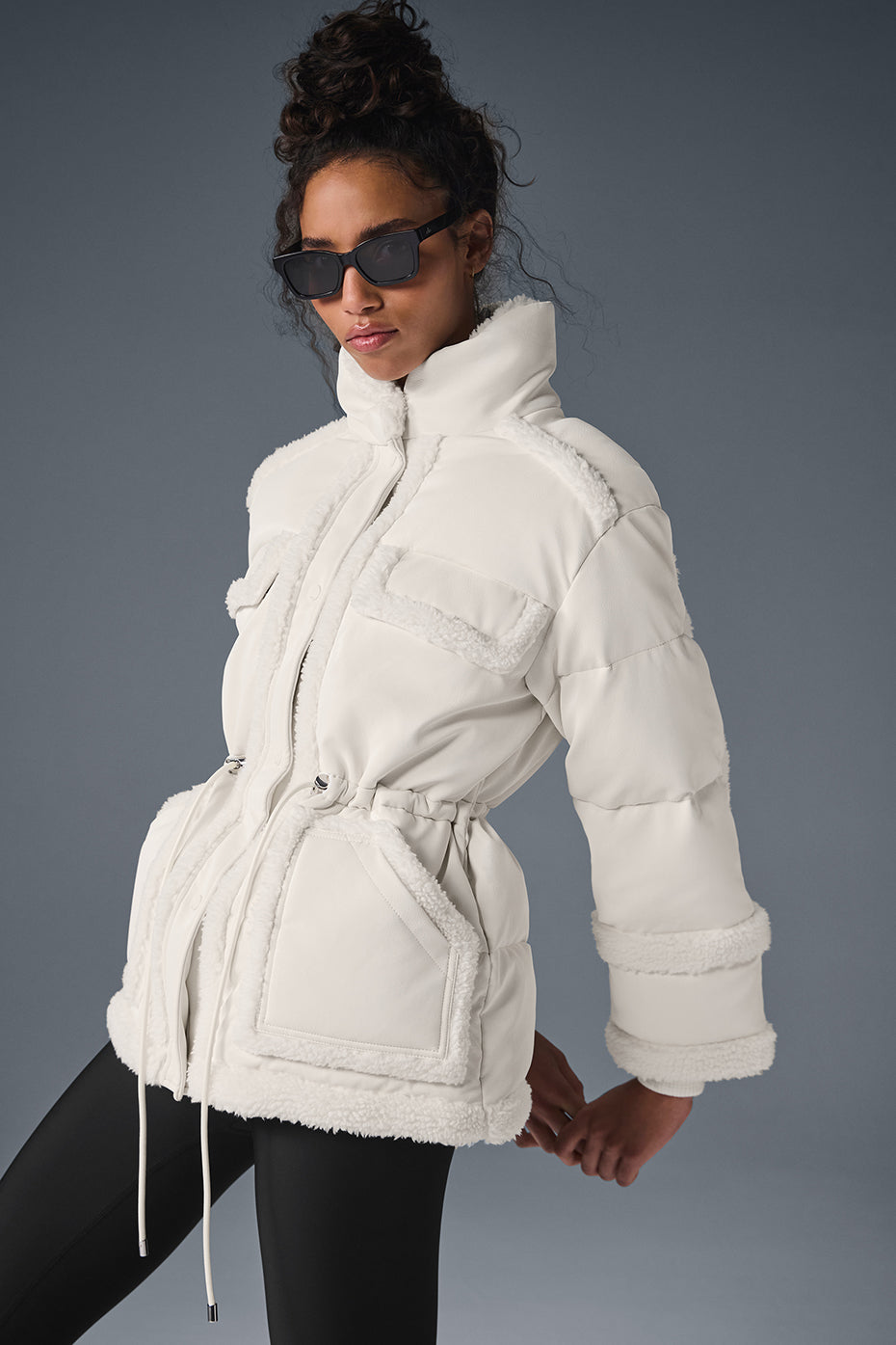 Close-up of faux leather texture on the Ivory Luxe Puffer Jacket.