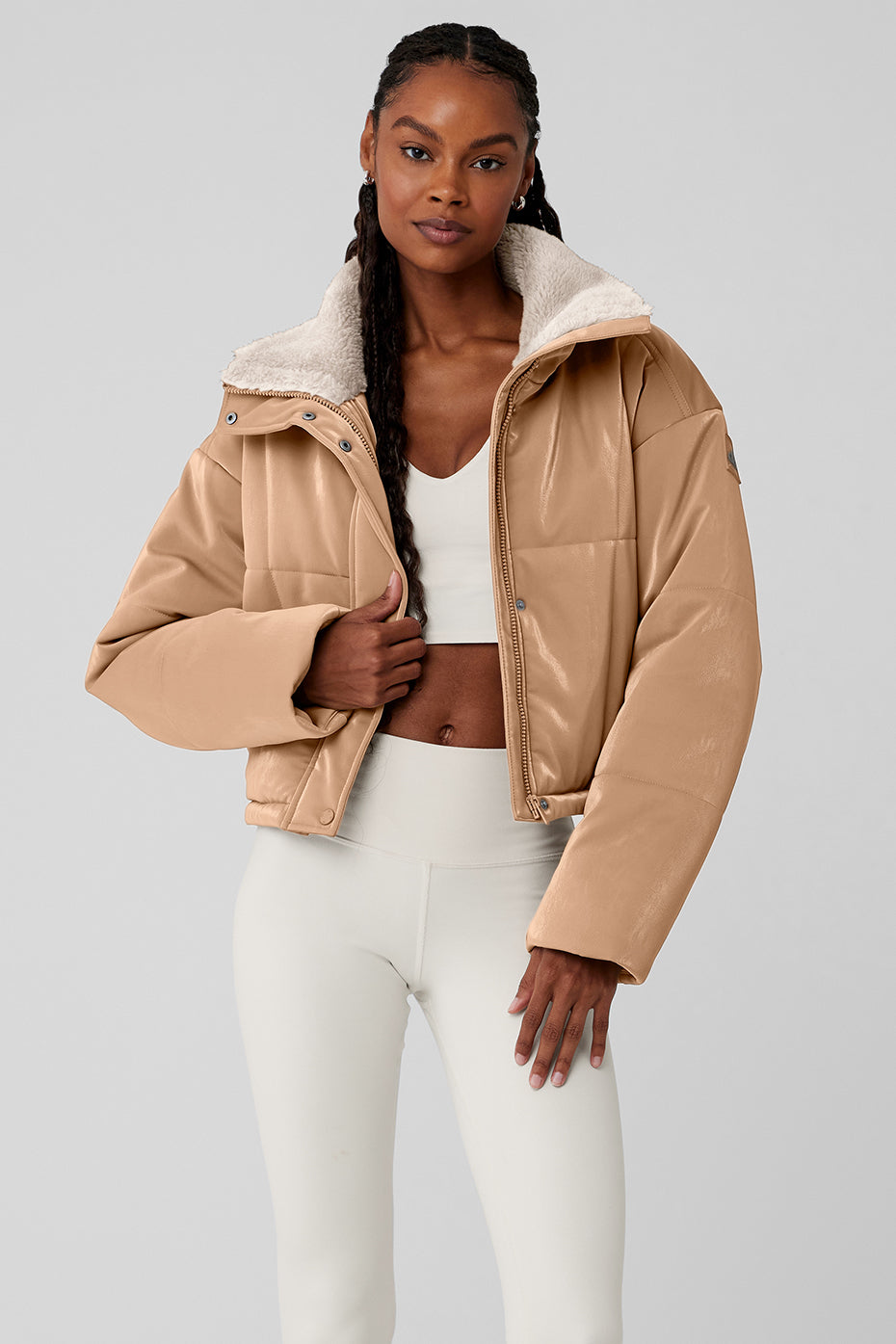 Front view of the cropped puffer jacket in Toasted Almond.