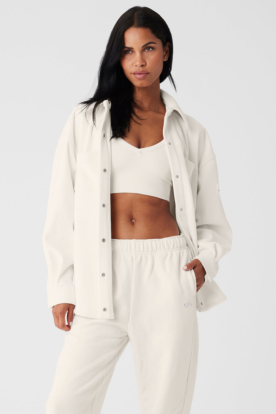 Front view of ivory ribbed velour shacket with patch pockets.