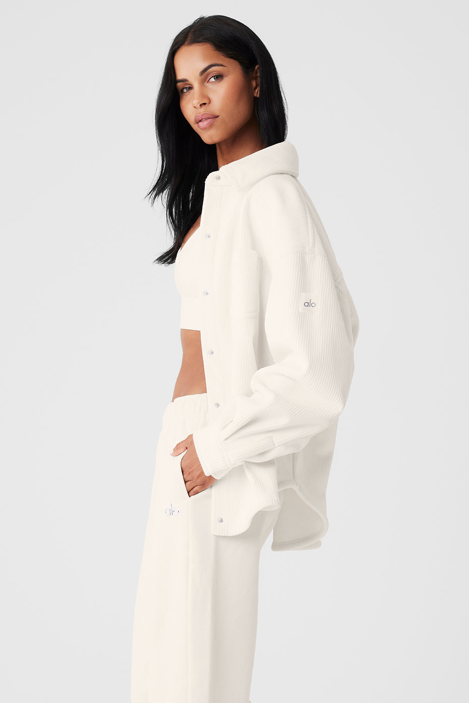 Model wearing the ivory shacket over a casual outfit.