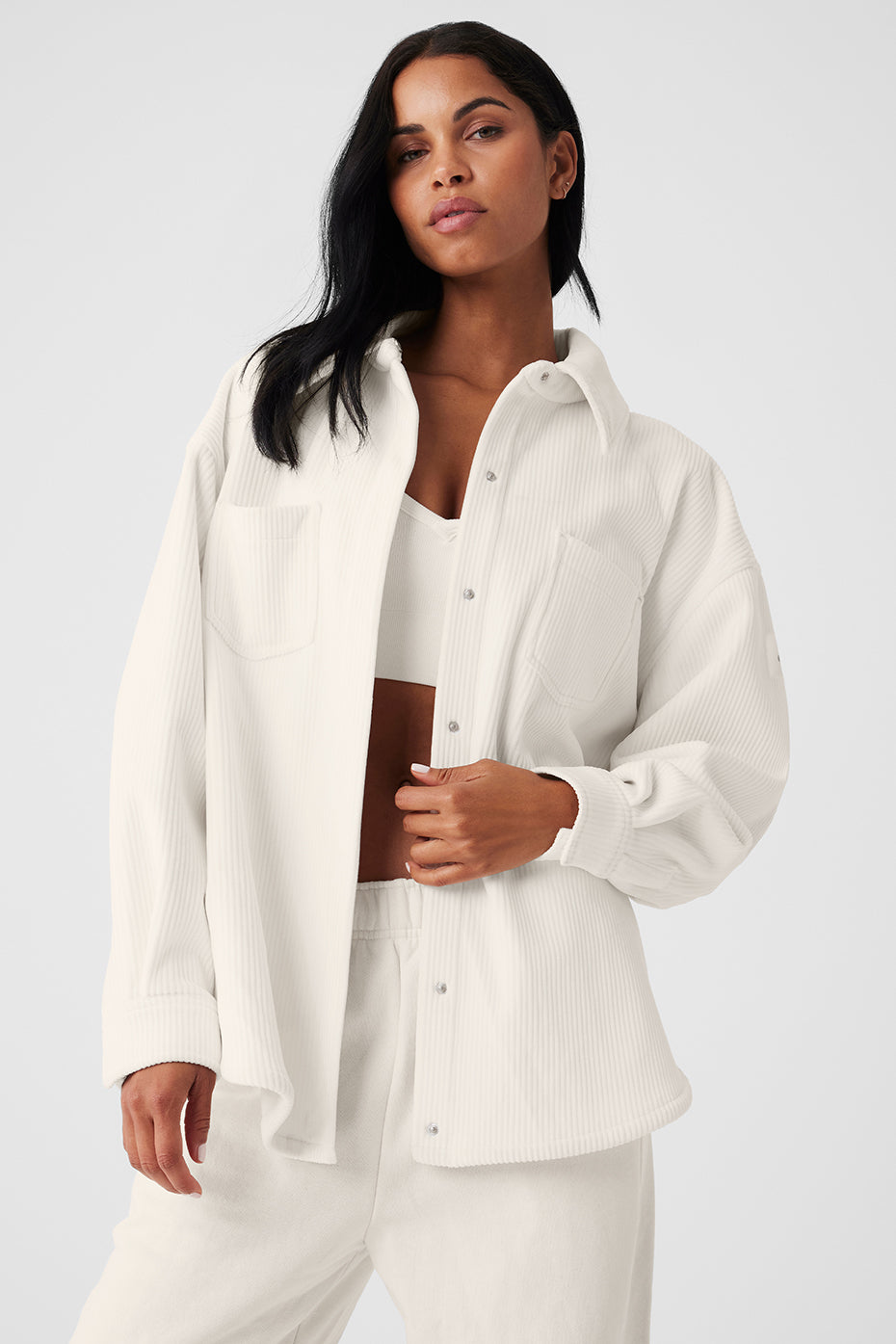 Front view of ivory ribbed velour shacket with patch pockets.
