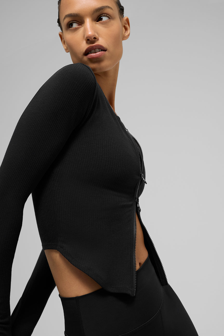 Close-up of the ribbed texture on the black long sleeve top