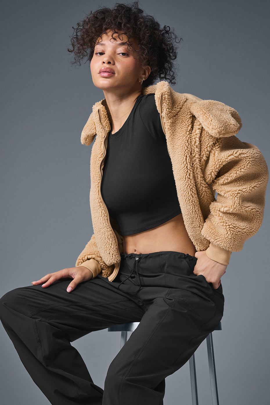 Styled shot of the womens bomber jacket with a casual outfit, perfect for chilly days