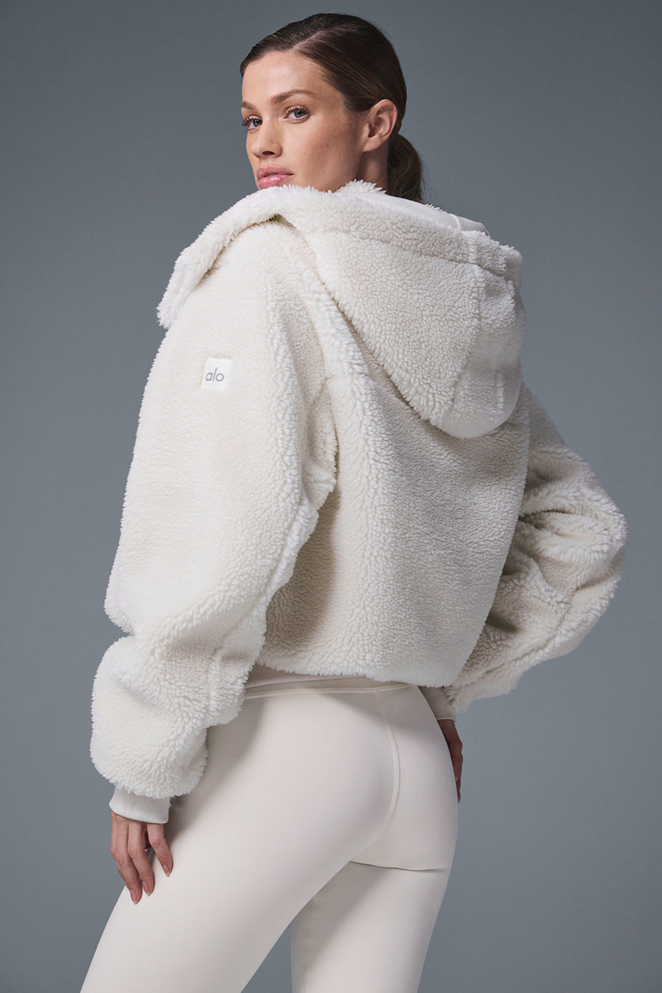 Close-up of the Foxy Sherpa Jackets plush fabric and zipper.