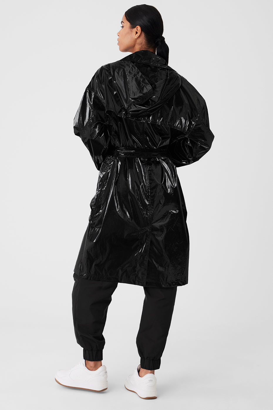 Side view showing break line seam details on metallic trench coat