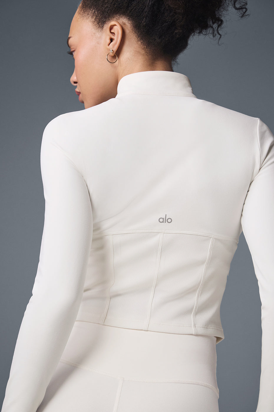 Side angle of the womens fleece jacket full zip, highlighting its smooth fit.