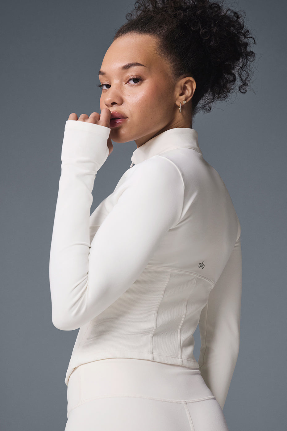 Front view of the ivory corset jacket with full zip and thumbholes.