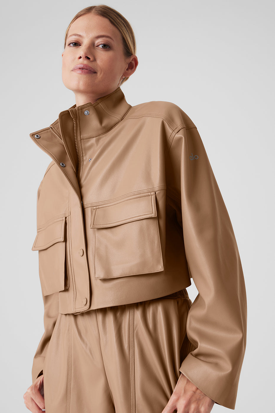 Front view of the chic faux leather power hour jacket in toasted almond.