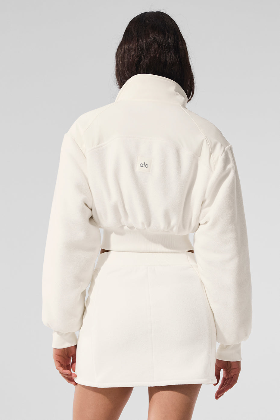 Styled with high-waisted pants for a casual winter look
