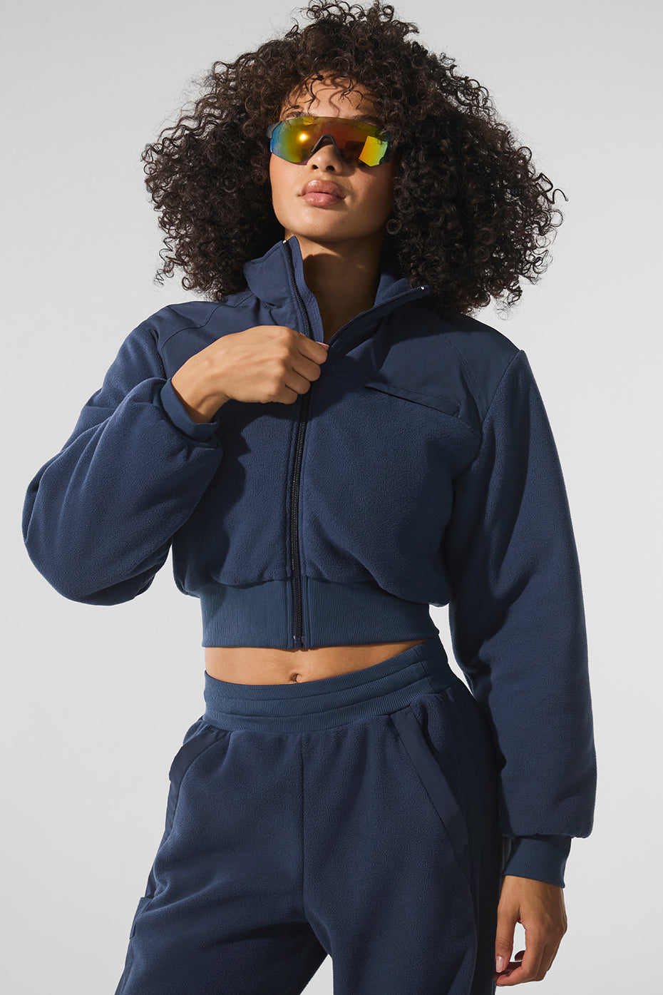 Front view of the navy cropped fleece winter jacket