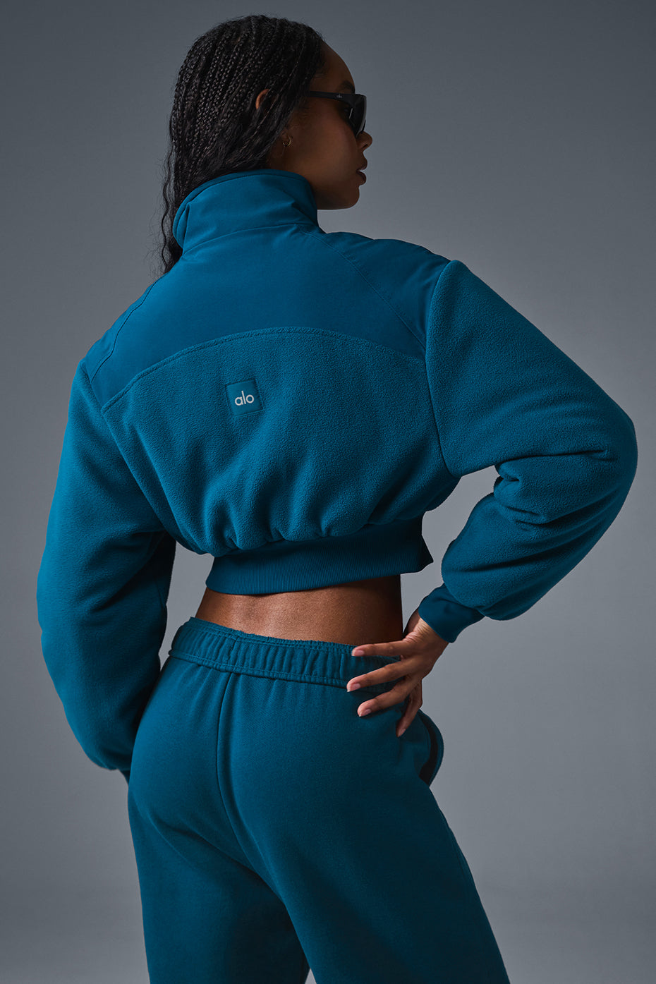Model wearing the cropped winter jacket in an outdoor setting during winter