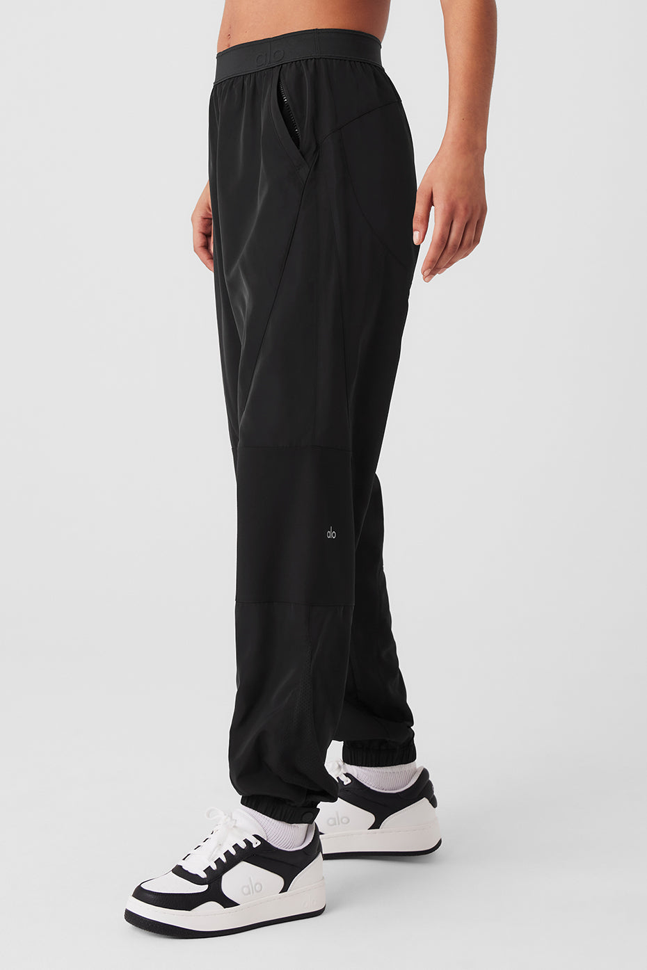 Casual look featuring black joggers and matching jacket.