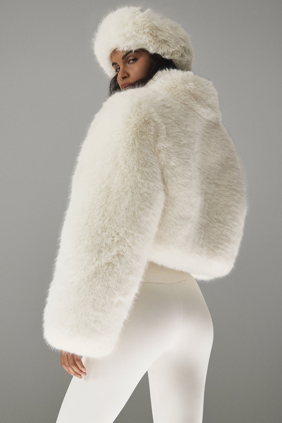 Side view showcasing the stand collar of the cropped jacket