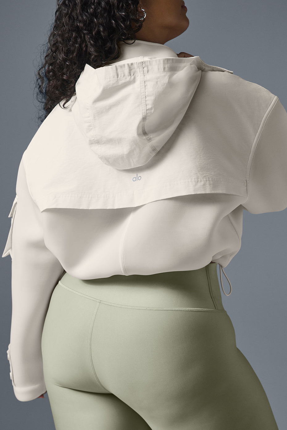 Front view of the chic ivory cropped cargo jacket showcasing its stylish design.