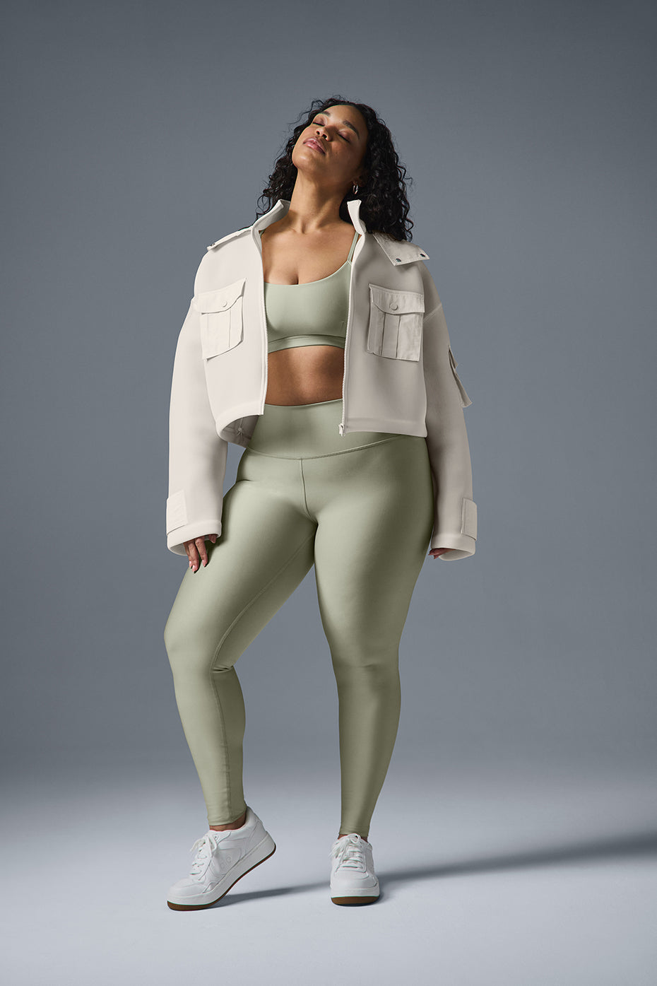 Front view of the chic ivory cropped cargo jacket showcasing its stylish design.