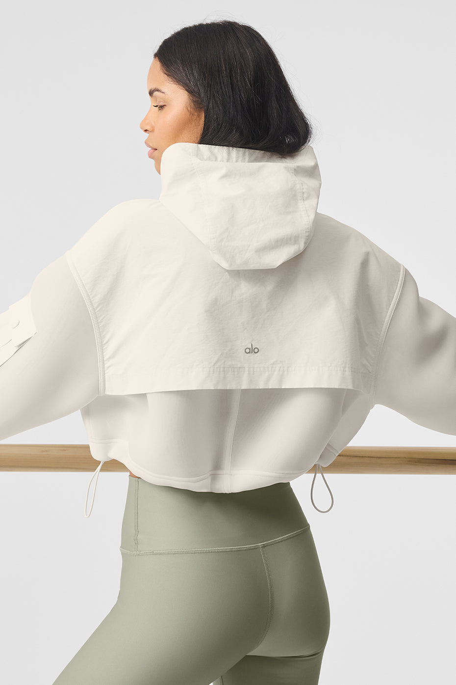 Back view of the womens scuba jacket demonstrating the adjustable hood.
