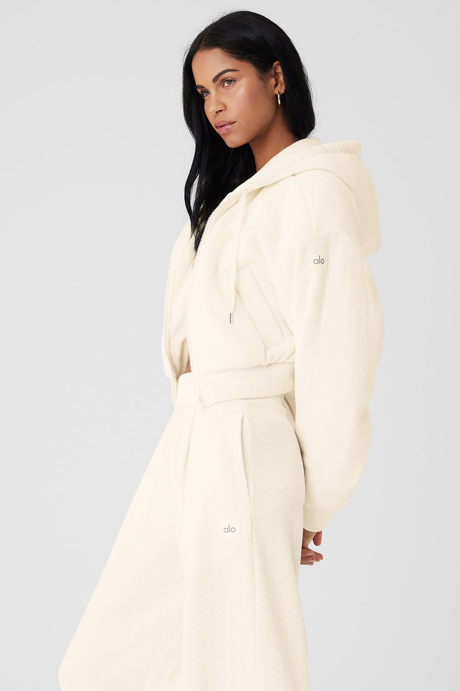 Front and back view of puffer jacket laid flat showing hood detail