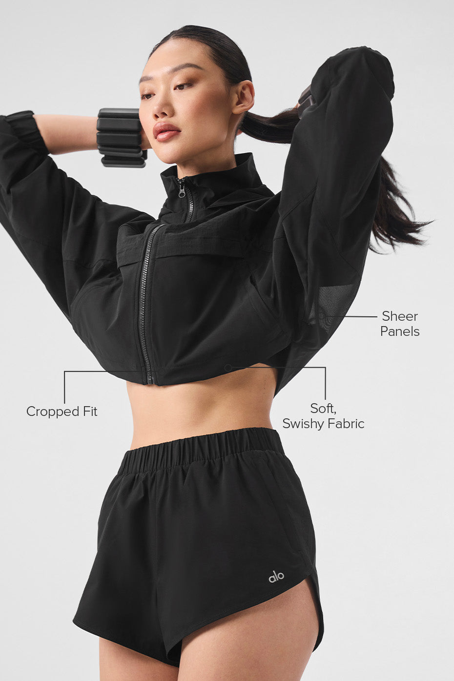 Side angle of the cropped fur jacket, highlighting the sheer panels.