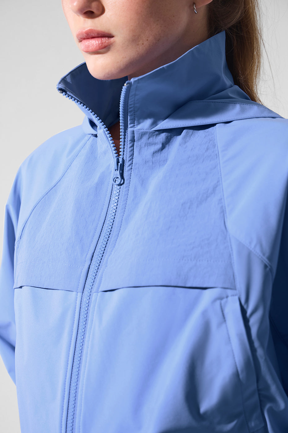 Close-up of ripstop panels on clear blue jacket