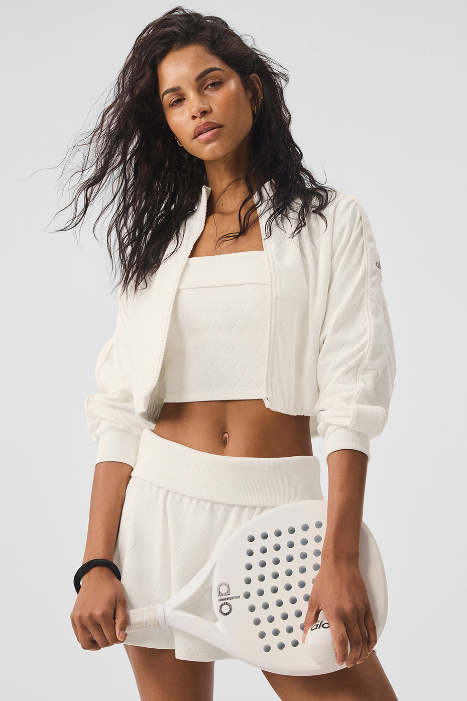 Front view of ivory cropped leather jacket with full zip and ribbed finish