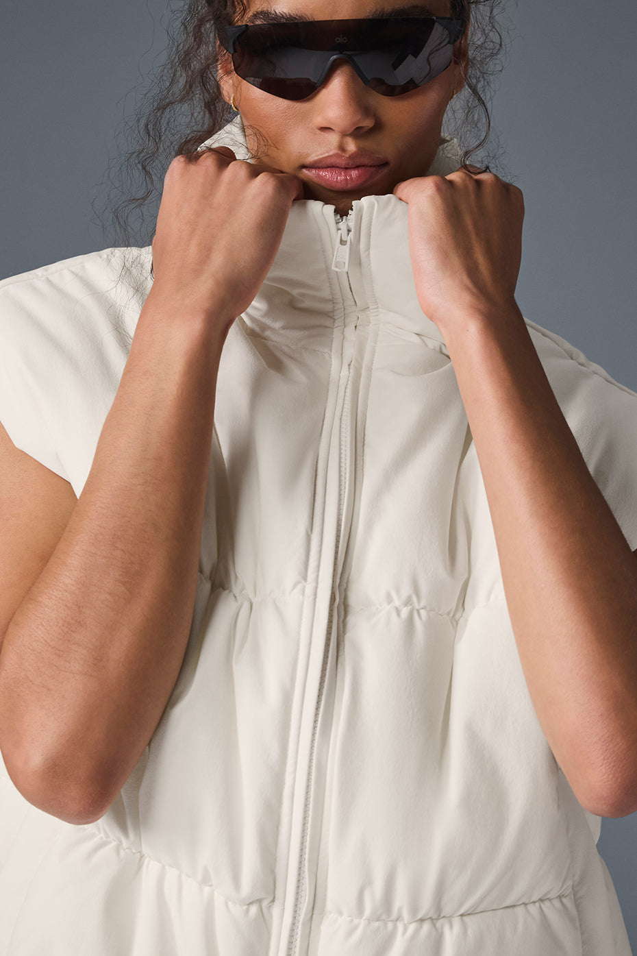 Side view showcasing the oversized fit of the puffer vest.