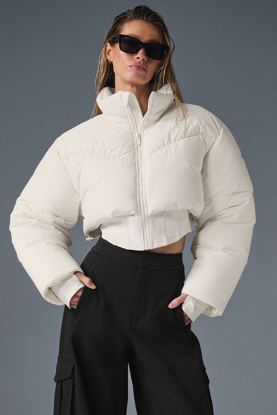 Close-up of corset detailing on black puffer jacket
