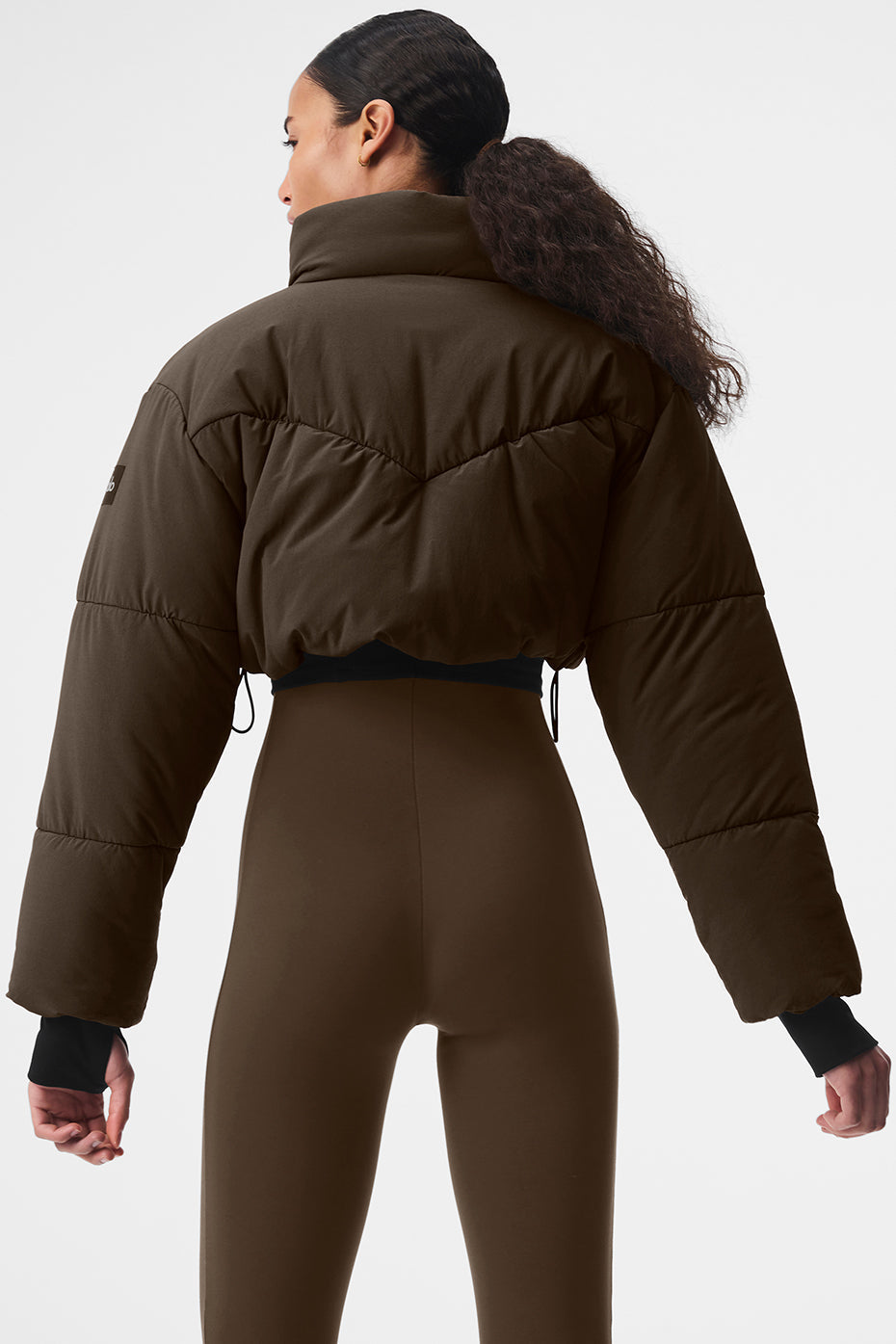 Model wearing the puffer jacket outdoors, demonstrating its warmth and style.