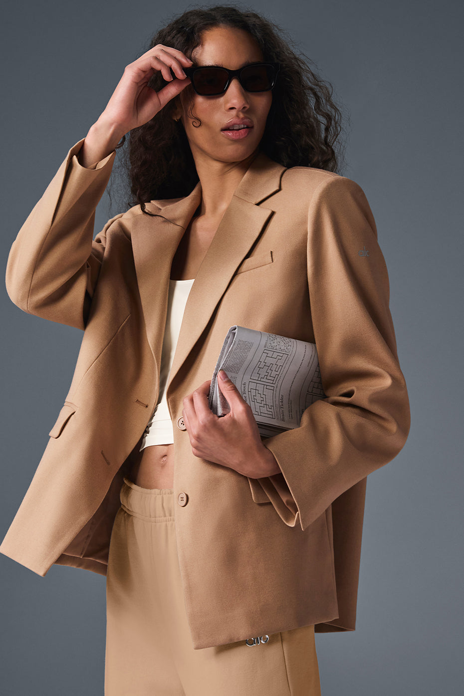 Close-up of the oversized blazer's lapels and tailored fit in toasted almond color
