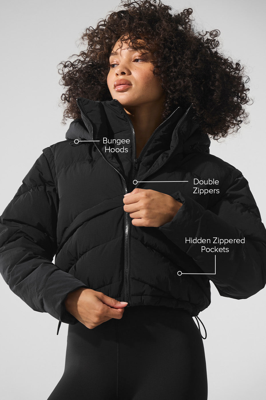 Side view of the Glacier Black Puffer Jacket highlighting the double-zip closure.