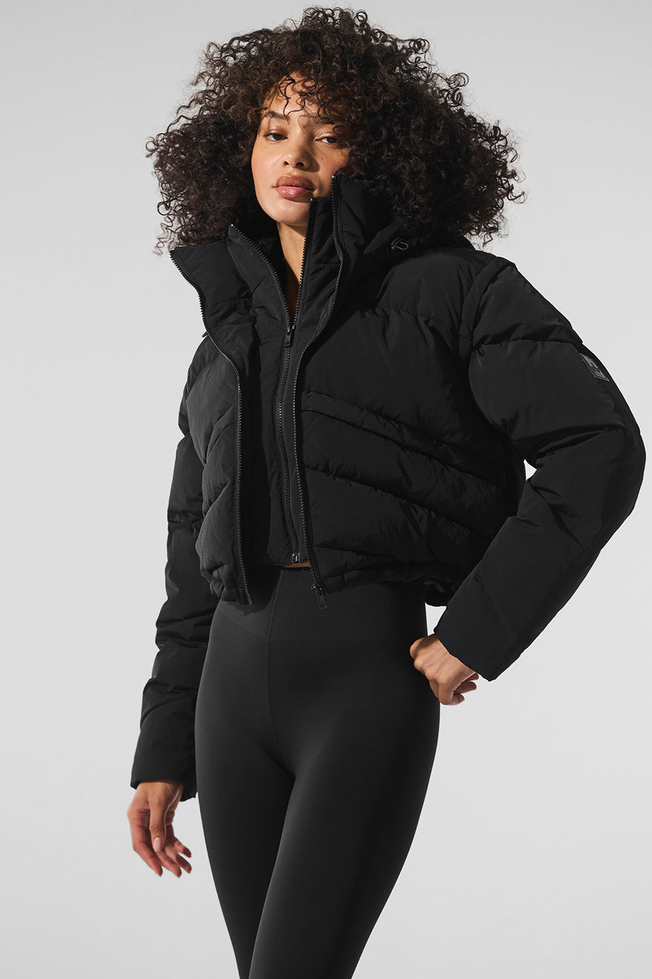 Front view of the Glacier Black Puffer Jacket showcasing its stylish design.