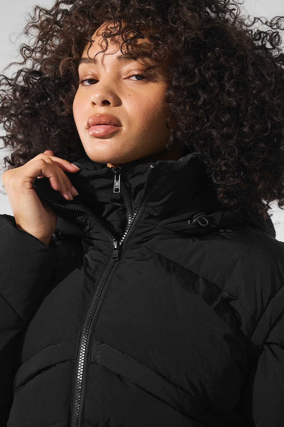 Front view of the Glacier Black Puffer Jacket showcasing its stylish design.