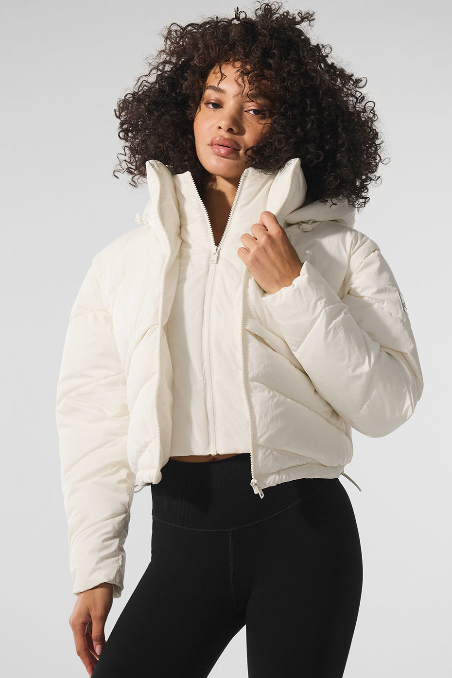 Front view of ivory Glacier puffer jacket showing layered detailing