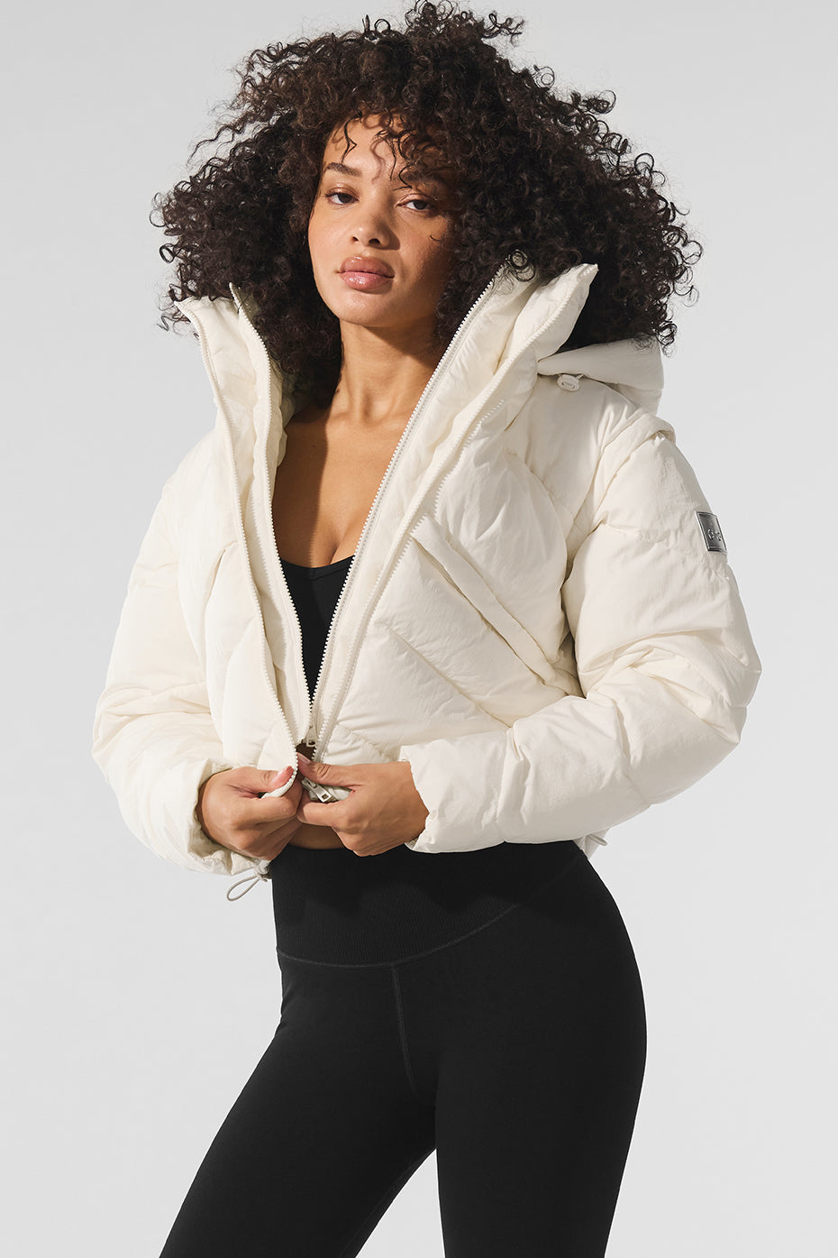 Front view of ivory Glacier puffer jacket showing layered detailing
