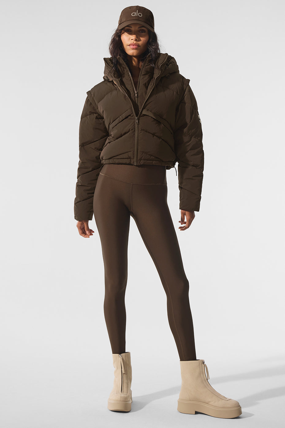 Close-up of double zipper and layered vest-style top panel