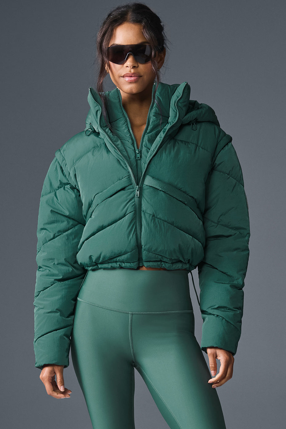 Front view of the Ivy Glacier mens puffer jacket in winter cityscape.