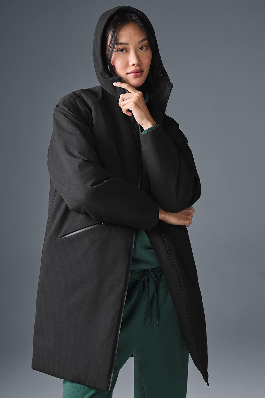 Front view of the chic black long puffer coat for women, showcasing its stylish design.