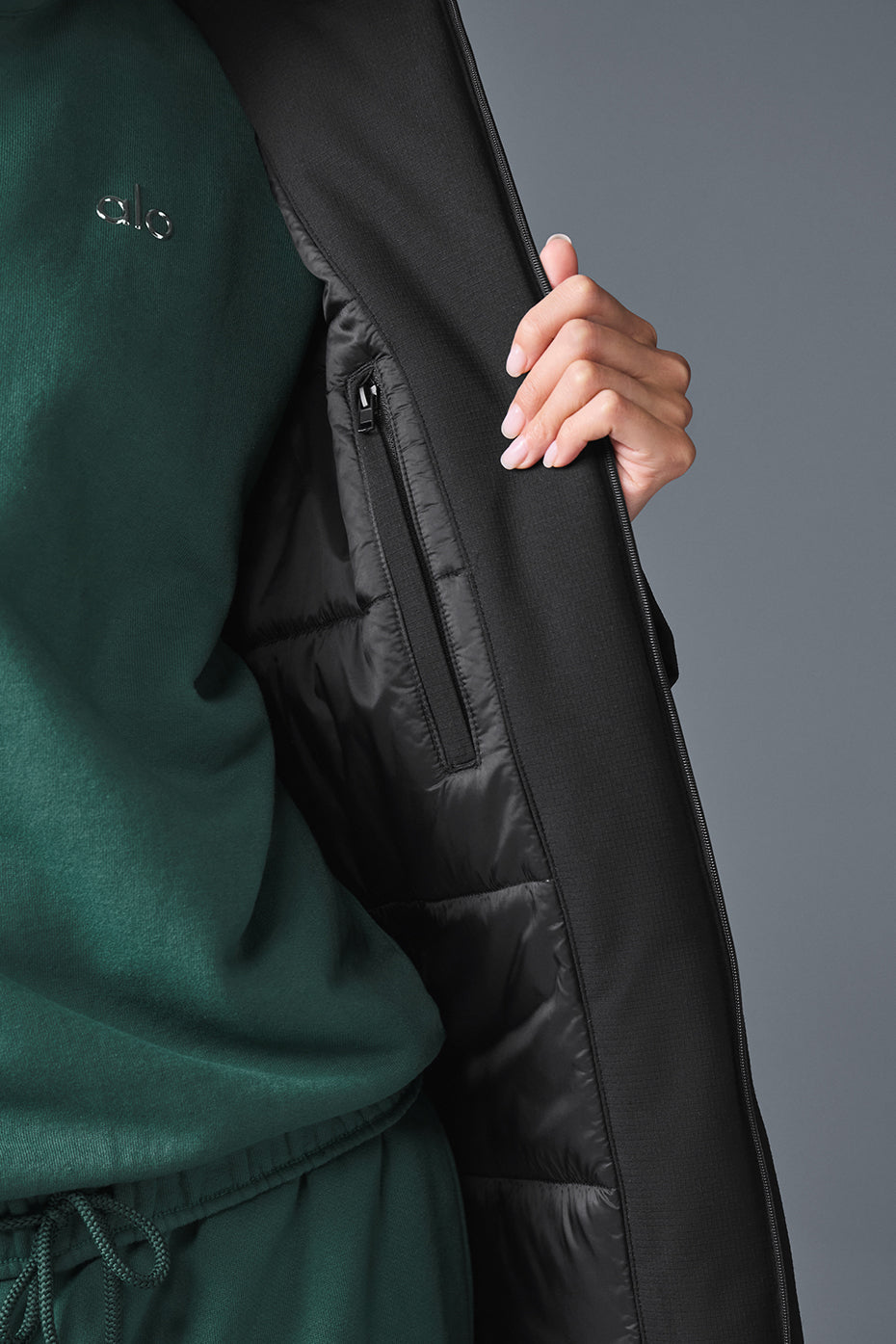 Front view of the chic black long puffer coat for women, showcasing its stylish design.