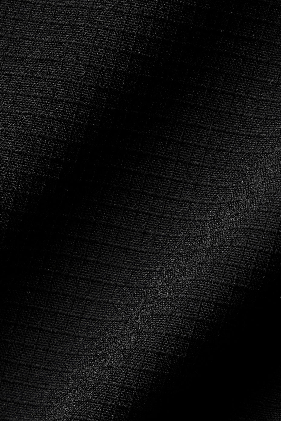Back view of the black puffer coat, demonstrating its lightweight and warm interior.