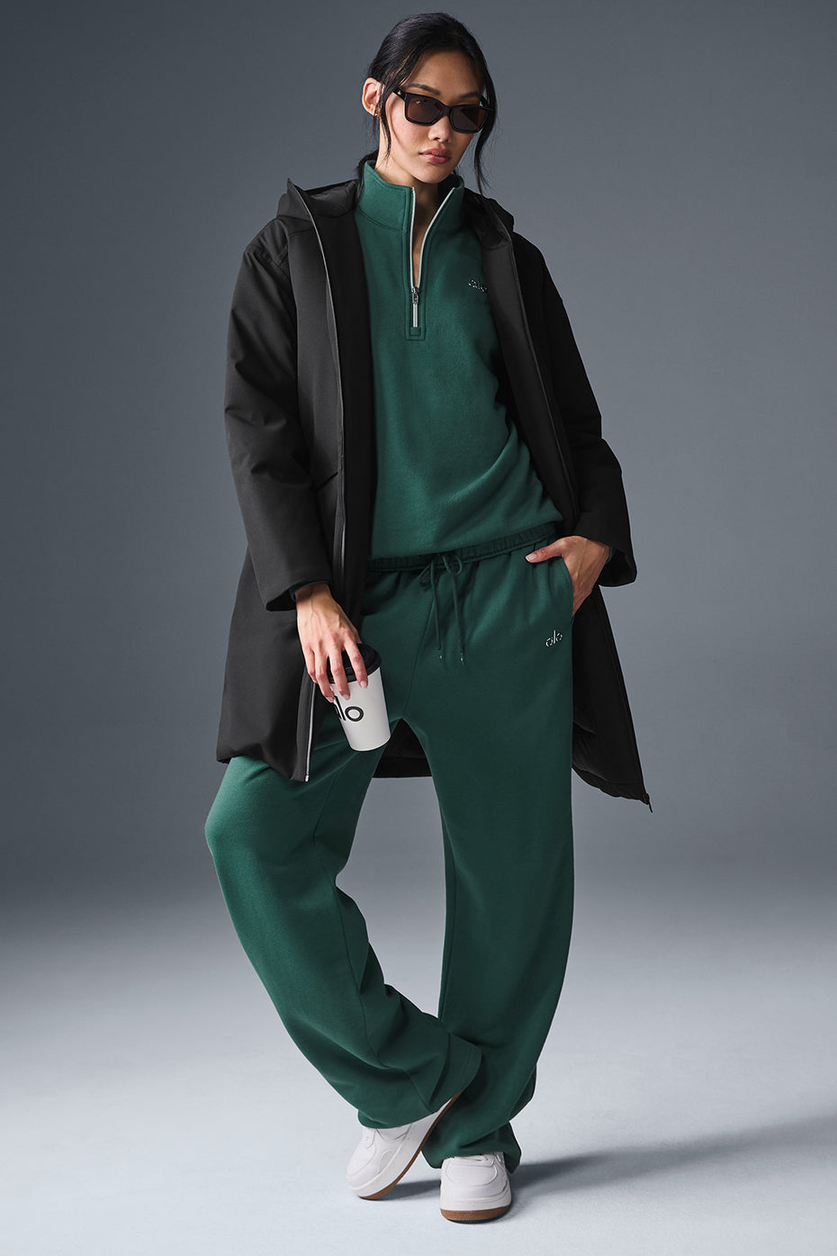 Side view of the womens long puffer coat, highlighting its water-resistant features.
