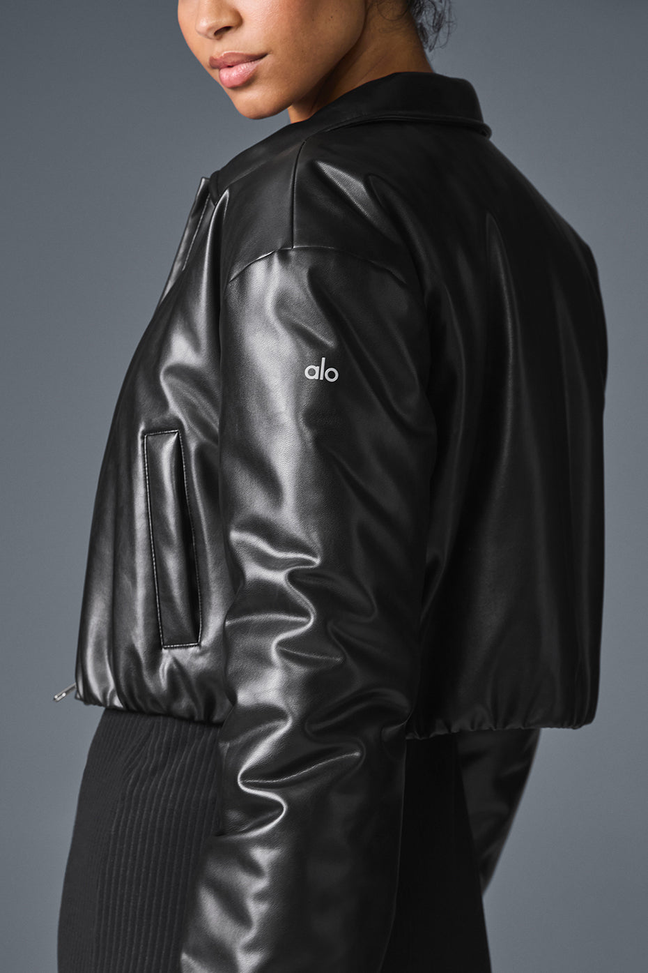 Model wearing a cropped puffer jacket for a stylish look.