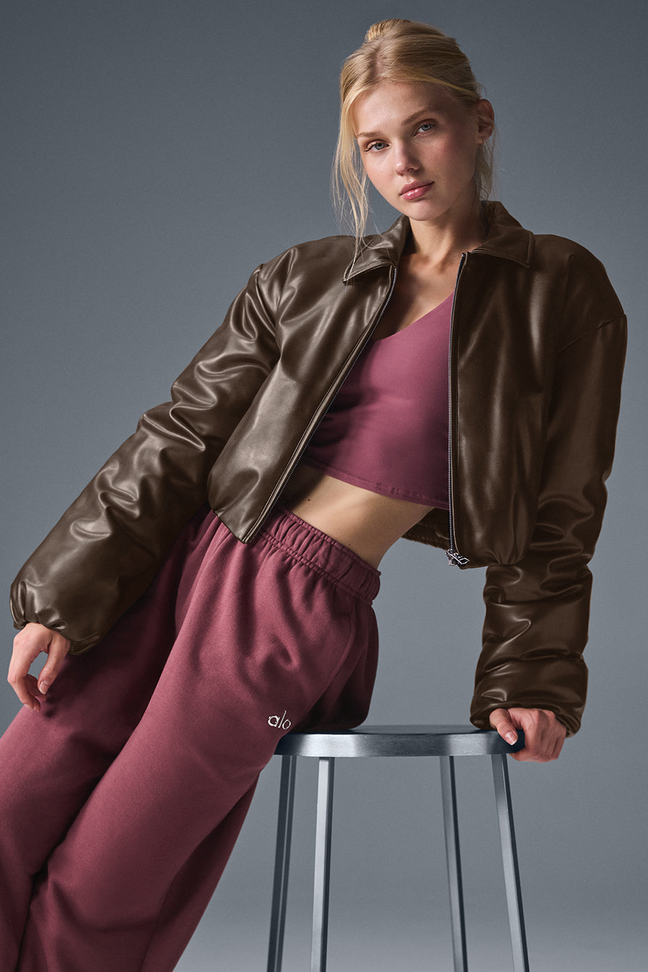 Front view of the chic faux leather cropped bomber jacket in espresso.