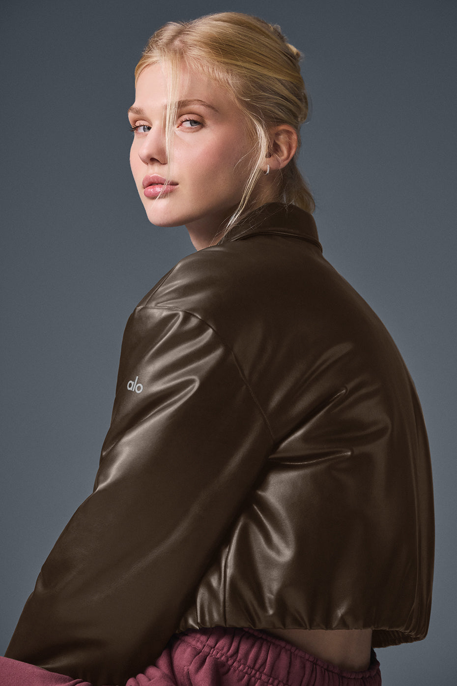 Model wearing the cropped bomber jacket with a casual outfit.
